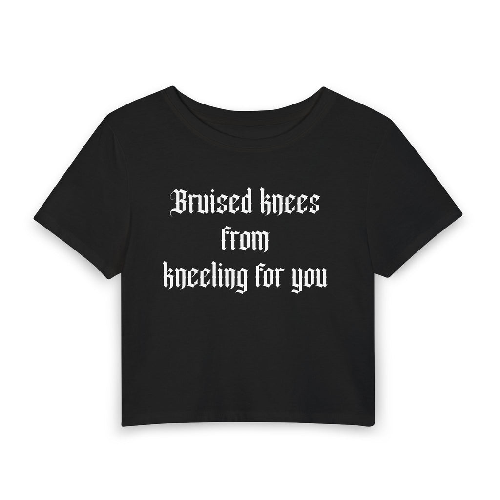Women's Baby Tee — "Bruised knees from kneeling for you" Gothic Text Crop Top